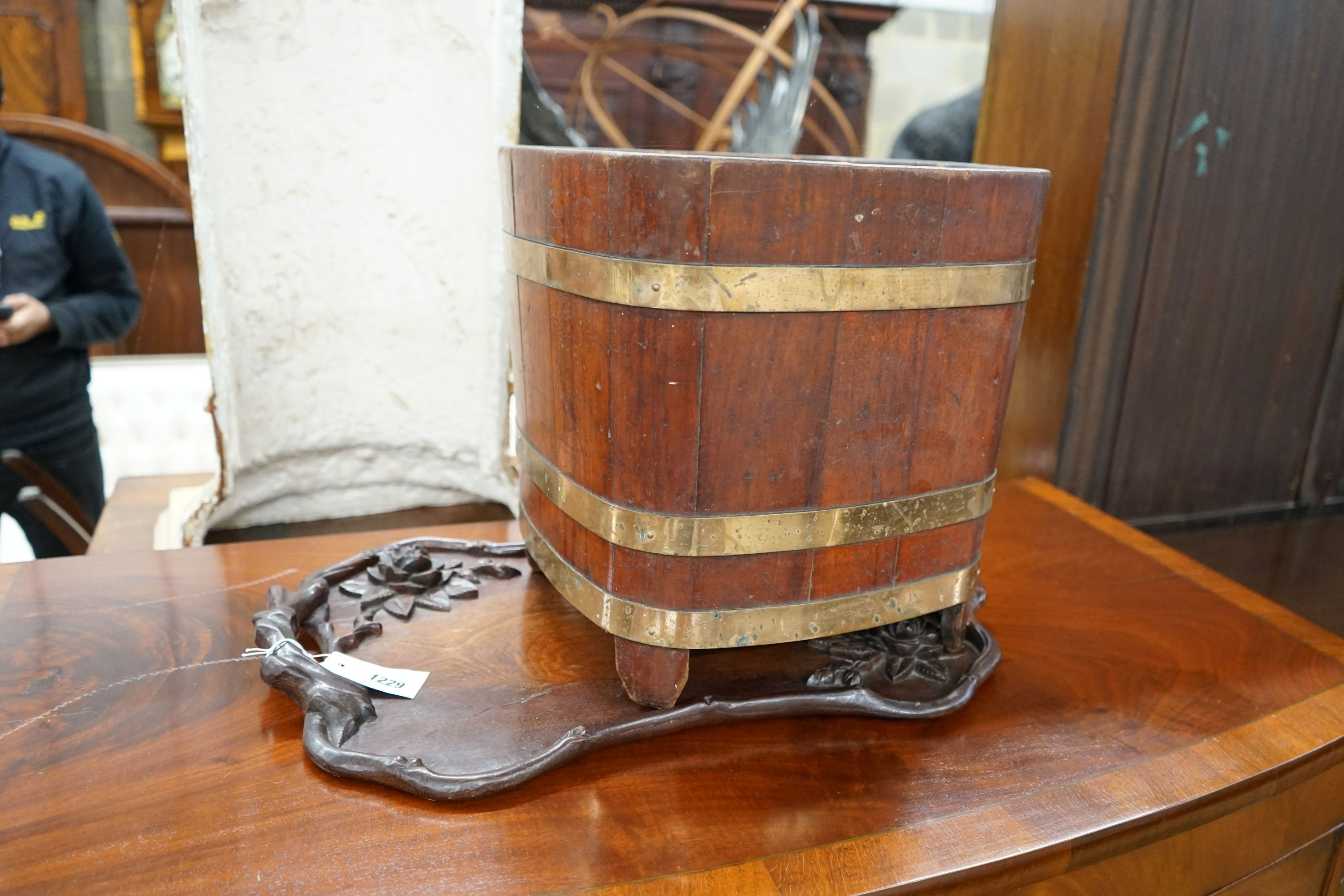 A brass bound staved mahogany waste paper bin, width 35cm, height 36cm together with a Chinese carved hardwood tray
